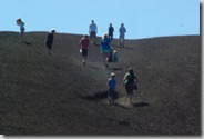 group of people going up Inferno Cone, Craters of the Moon National Monument and Preserve
