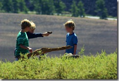 kids playing, Inferno Cone, Craters of the Moon National Monument and Preserve