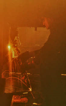 A welder in the round-house at the Chicago and Northwestern Railroad’s Proviso Yard A welder in the round-house at the Chicago and Northwestern Railroad’s Proviso Yard