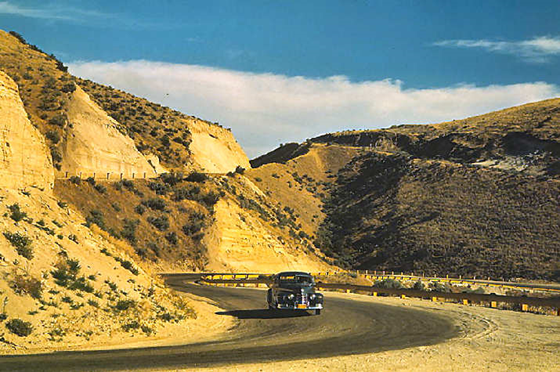 Road cut into the barren hills which lead into Emmett, Idaho - Photographer: Lee Russell, July 1941 Road cut into the barren hills which lead into Emmett, Idaho - Photographer: Lee Russell, July 1941