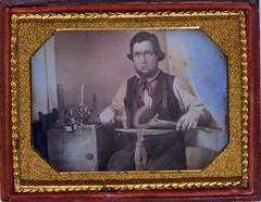 Occupational portrait of a blacksmith, three-quarter length, working on a horseshoe at an anvil, other tools to his side [between 1840 and 1860].
