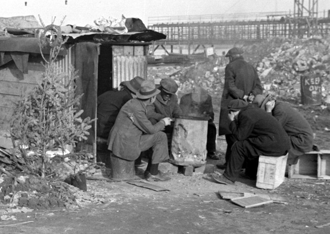 Unemployed workers in front of a shack with Christmas tree 8a22559a