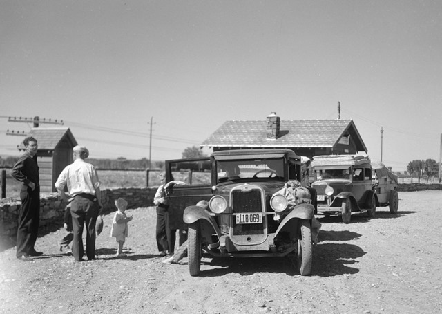DDD Part of the daily motorcade of drought refugees. The Montana-North Dakota state line
